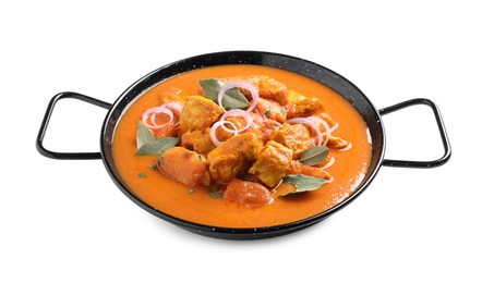 Delicious chicken curry in pan on white background