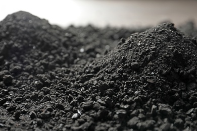 Photo of Heap of black coal, closeup view. Mineral deposits