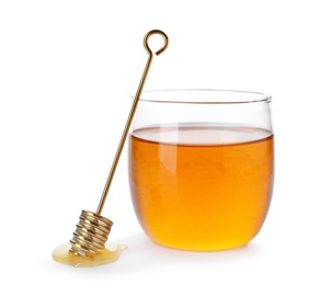 Jar with delicious honey and dipper on white background