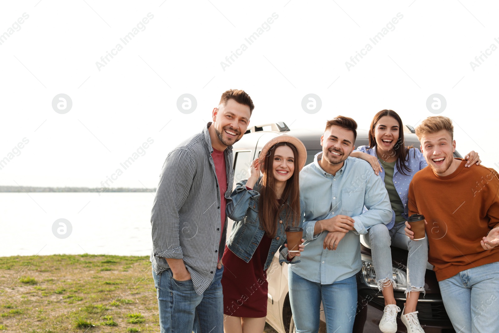 Photo of Group of happy people spending time together outdoors