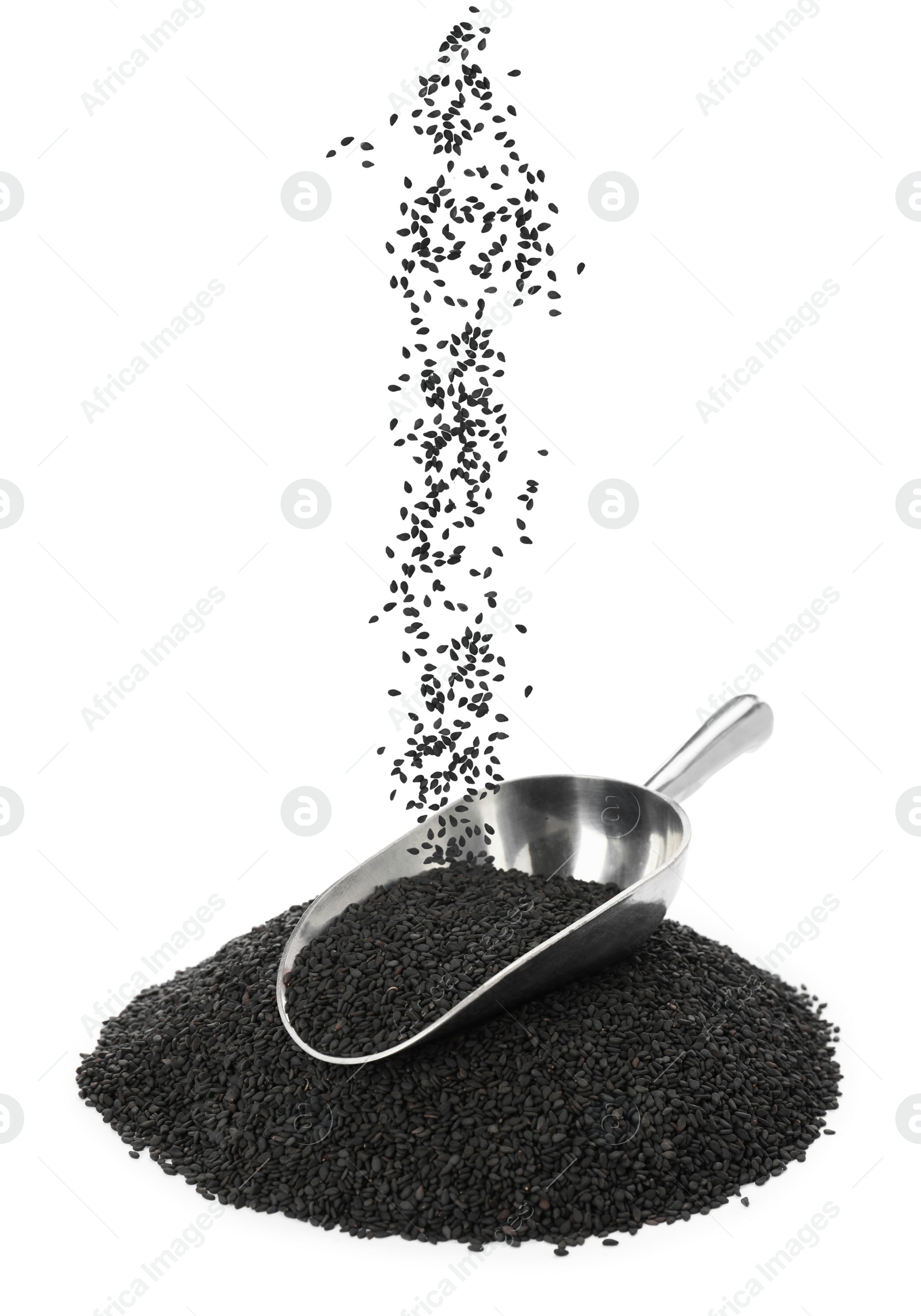 Image of Black sesame seeds falling into pile and scoop on white background