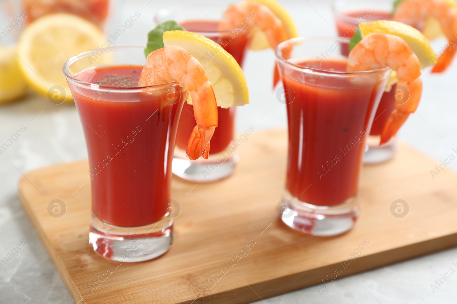 Photo of Delicious shrimp cocktail with tomato sauce served on  table