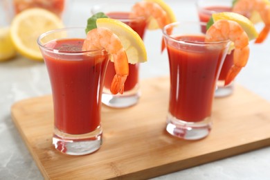 Photo of Delicious shrimp cocktail with tomato sauce served on  table