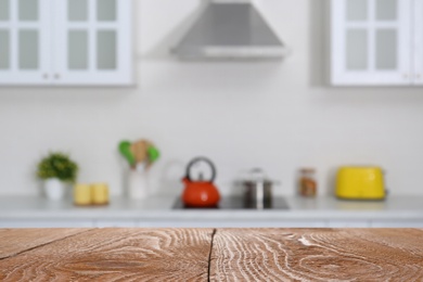 Image of Wooden table in light kitchen. Space for design