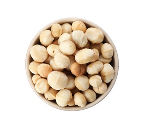 Photo of Bowl with shelled organic Macadamia nuts on white background, top view