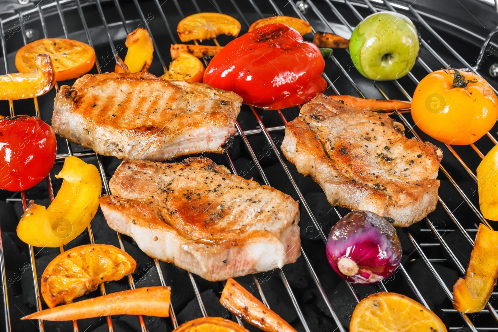 Photo of Modern barbecue grill with tasty food, closeup