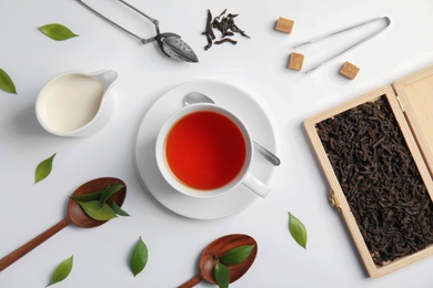 Photo of Flat lay composition with delicious tea on light background