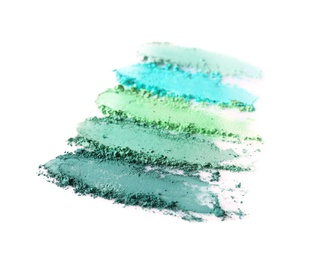 Photo of Crushed eye shadows on white background. Professional makeup products