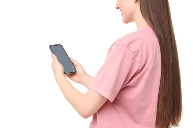 Woman holding smartphone with blank screen on white background, closeup. Mockup for design