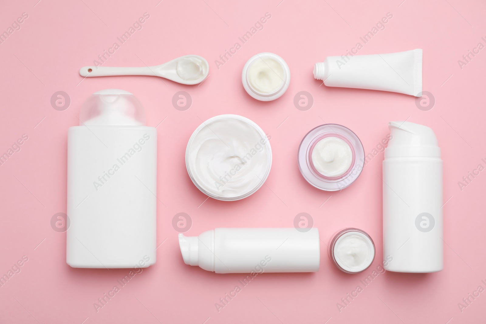 Photo of Flat lay composition with cosmetic products on color background