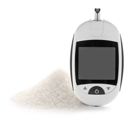 Photo of Digital glucometer and pile of sugar on white background. Diabetes concept