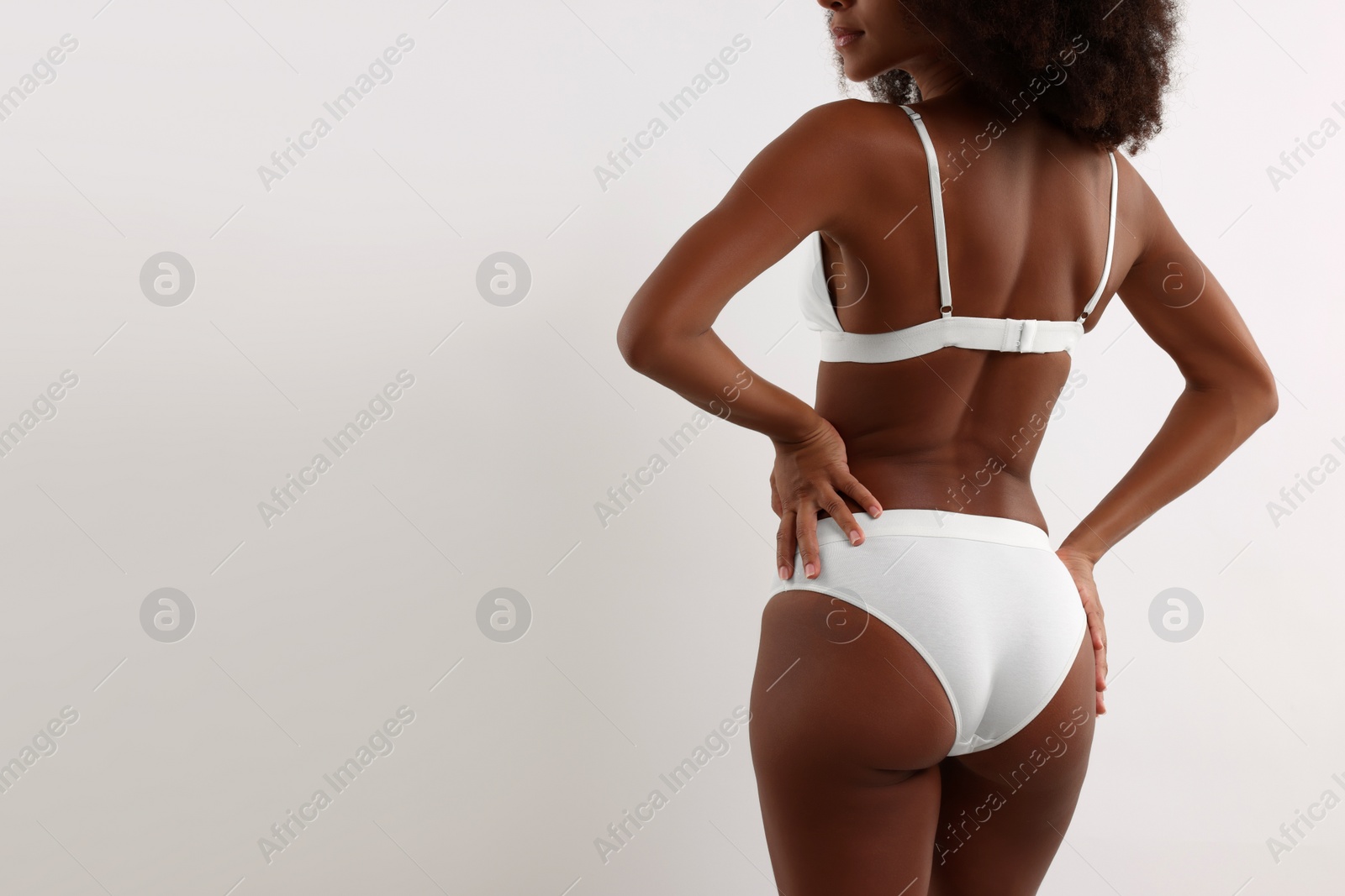 Photo of Woman in stylish bikini on white background, closeup. Space for text