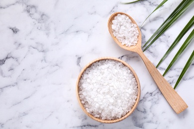 Photo of Flat lay composition with white sea salt on marble background, space for text. Spa treatment