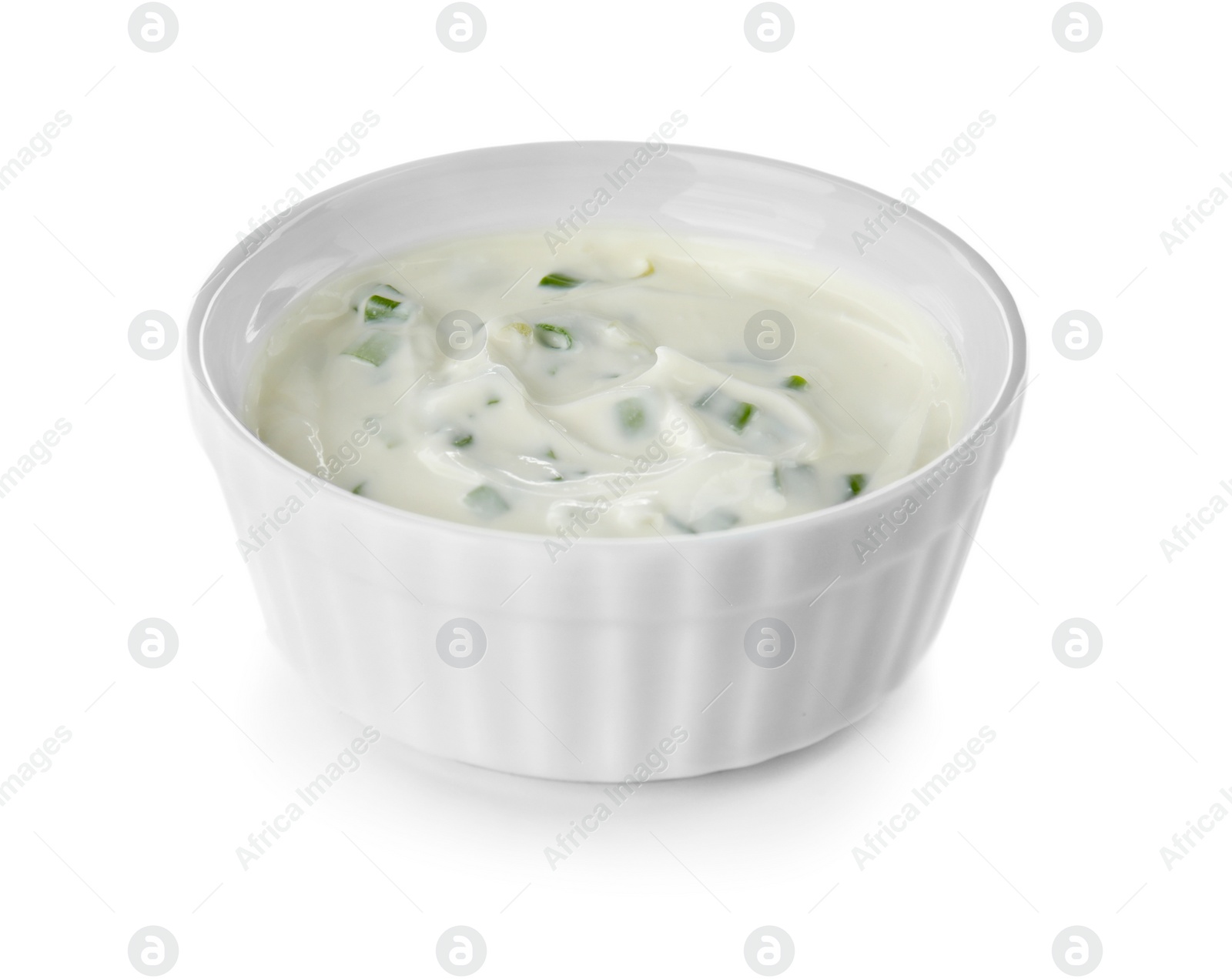 Photo of Bowl with sour cream and herbs on white background