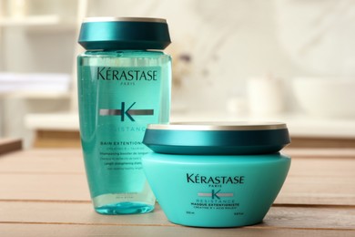 MYKOLAIV, UKRAINE - SEPTEMBER 07, 2021: Kerastase hair care cosmetic products on wooden table in bathroom