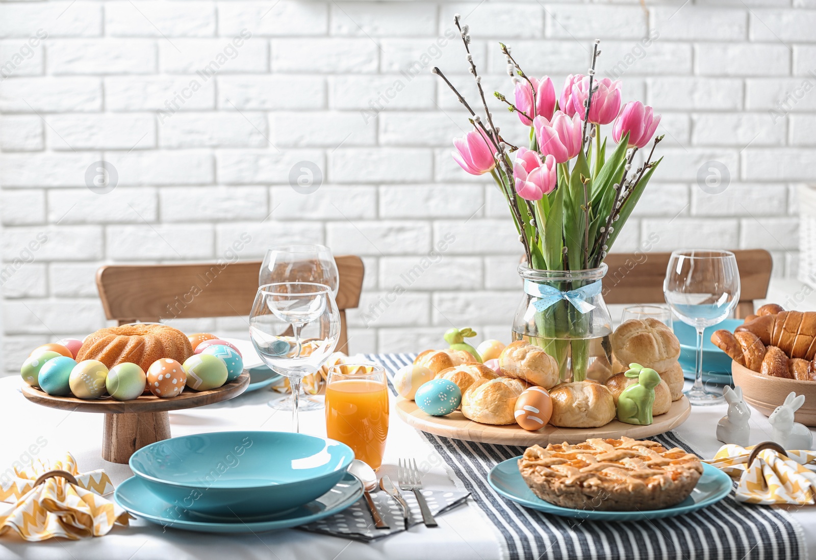 Photo of Festive Easter table setting with traditional meal at home