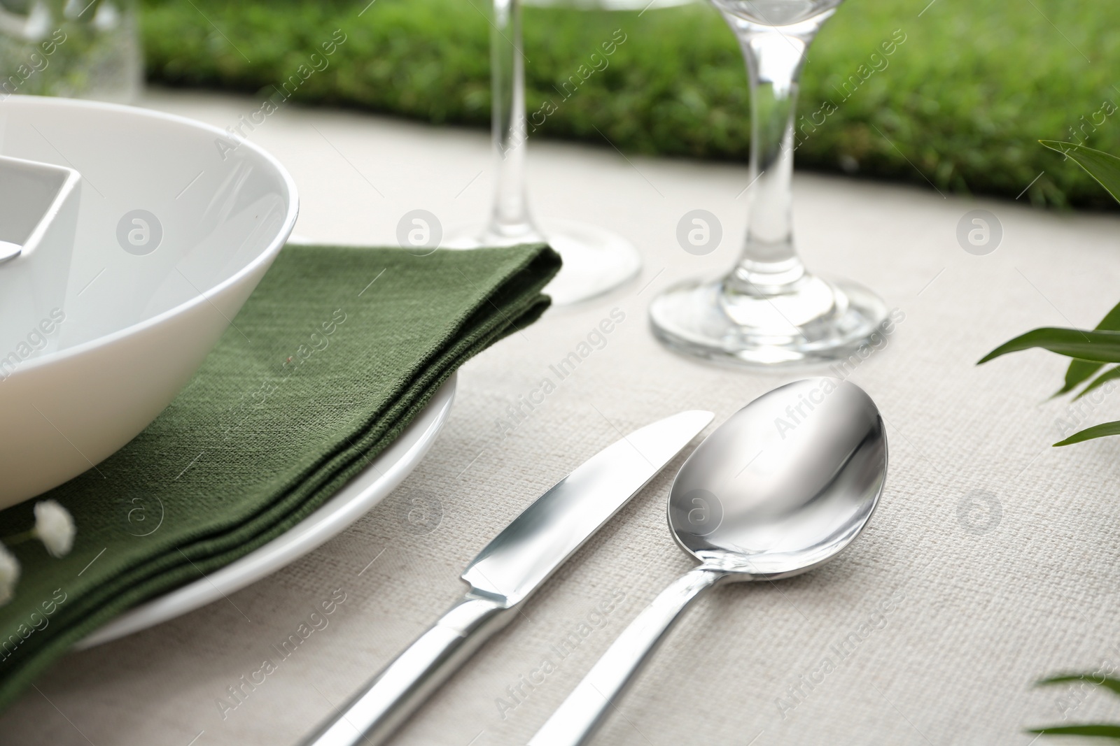 Photo of Elegant cutlery with on table, closeup. Festive setting