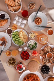 Dishes with different food on table, flat lay. Luxury brunch