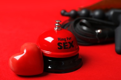 Photo of Set of different sex toys on red background