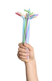 Woman holding bunch of plastic straws on white background, closeup