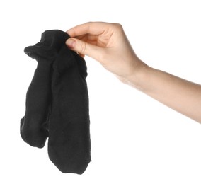 Photo of Woman holding dirty socks on white background, closeup