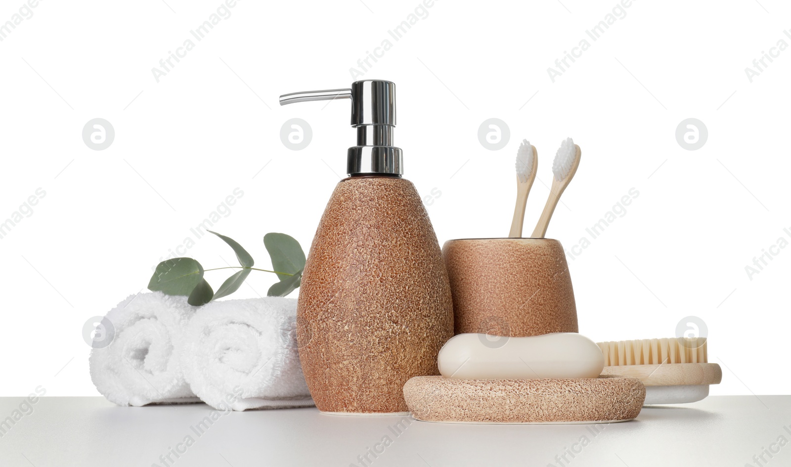 Photo of Bath accessories. Different personal care products and eucalyptus branch on table against white background