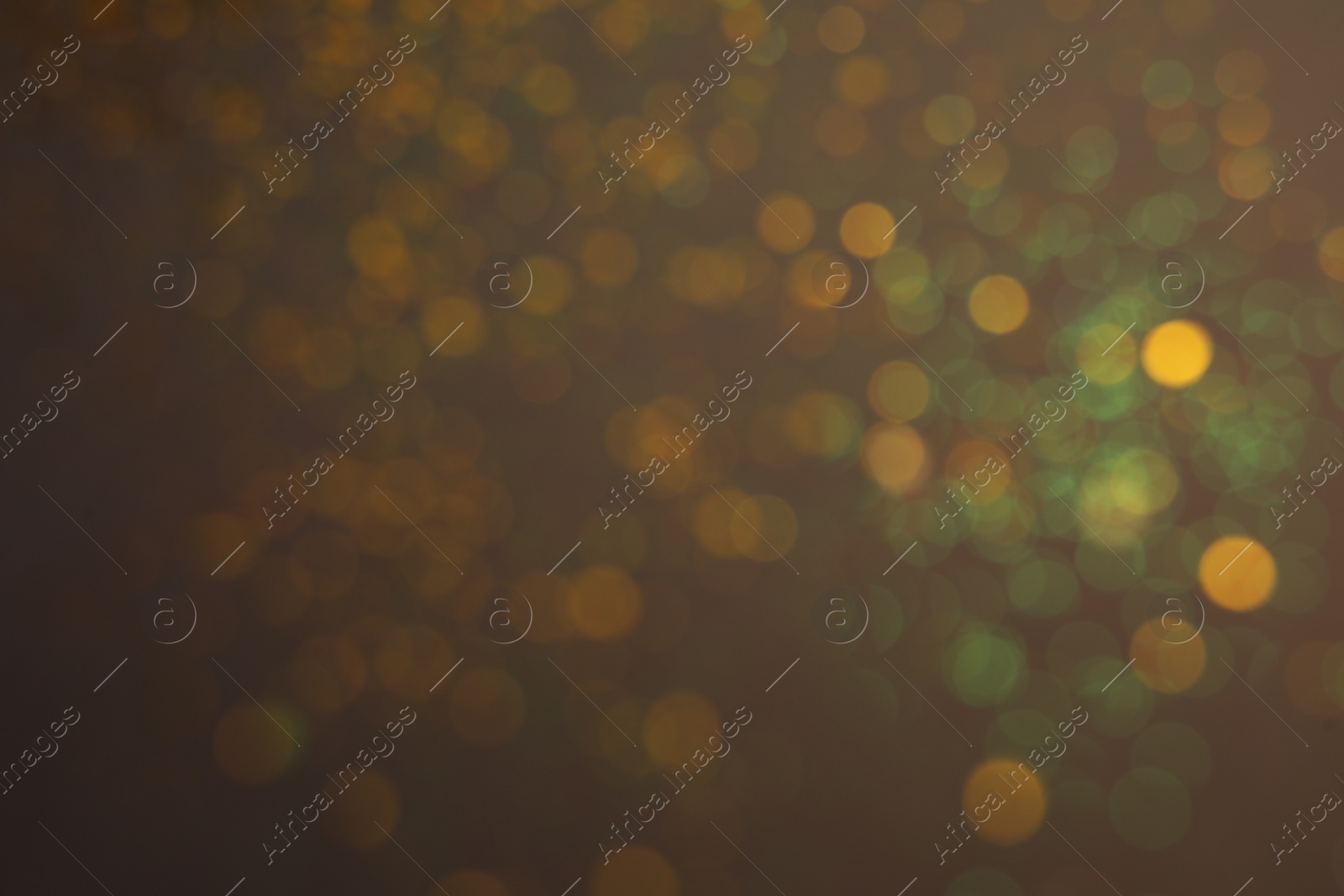 Photo of Blurred view of festive lights on grey background. Bokeh effect