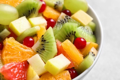 Photo of Bowl with fresh fruit salad, closeup
