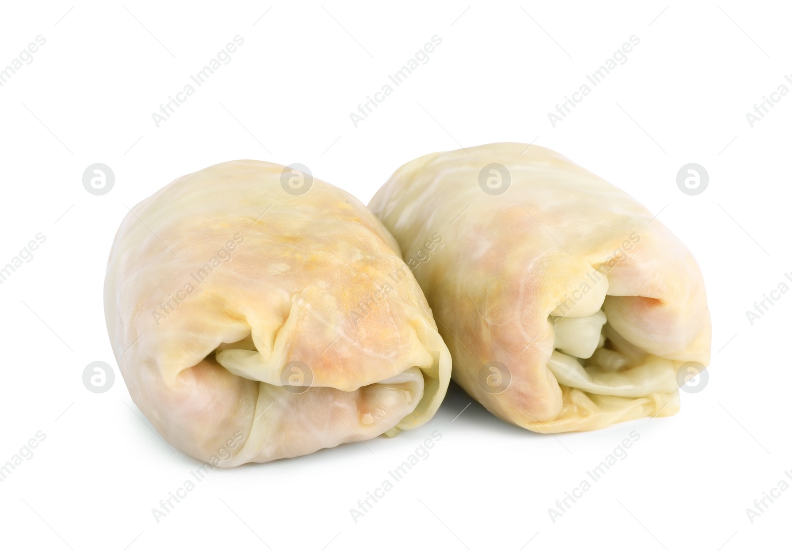 Photo of Uncooked stuffed cabbage rolls on white background