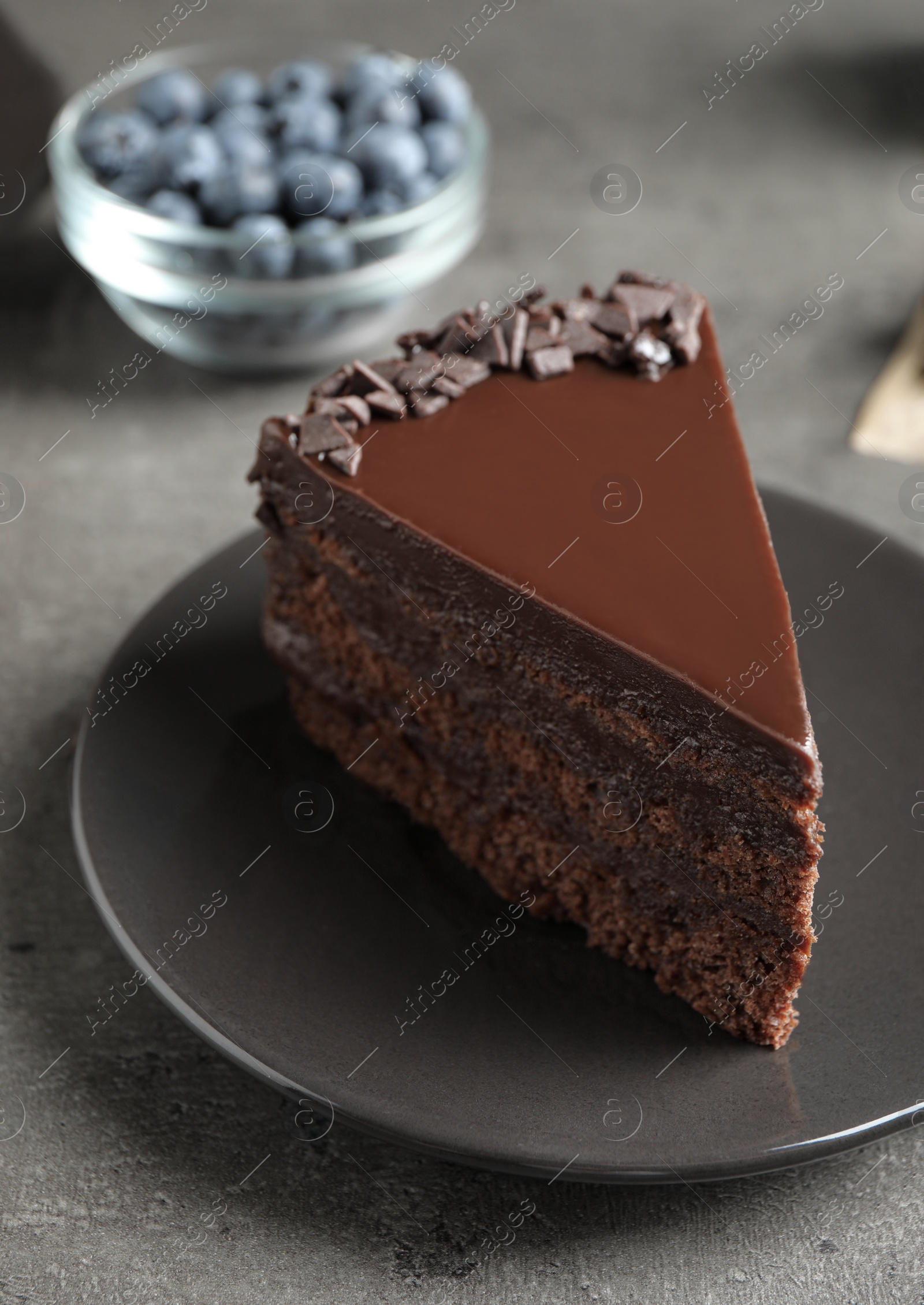 Photo of Delicious fresh chocolate cake served on grey table