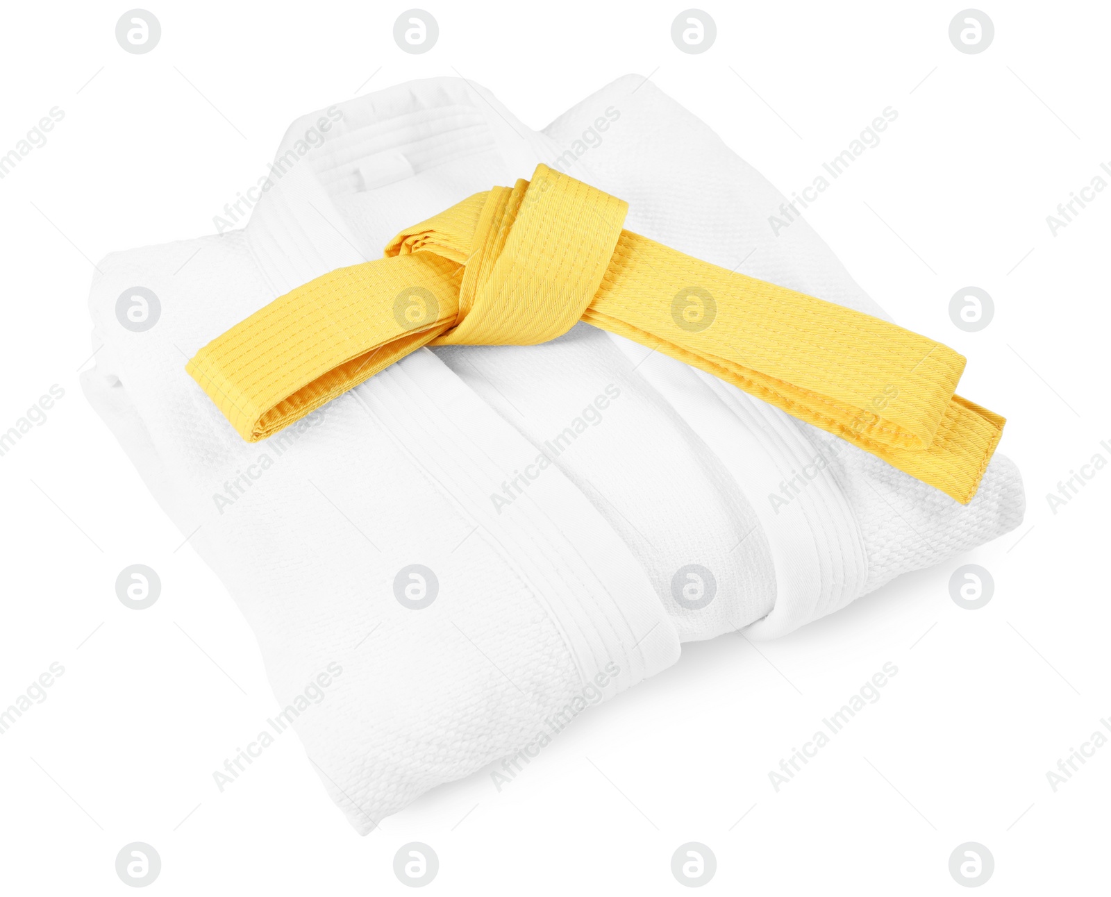 Photo of Yellow karate belt and kimono isolated on white