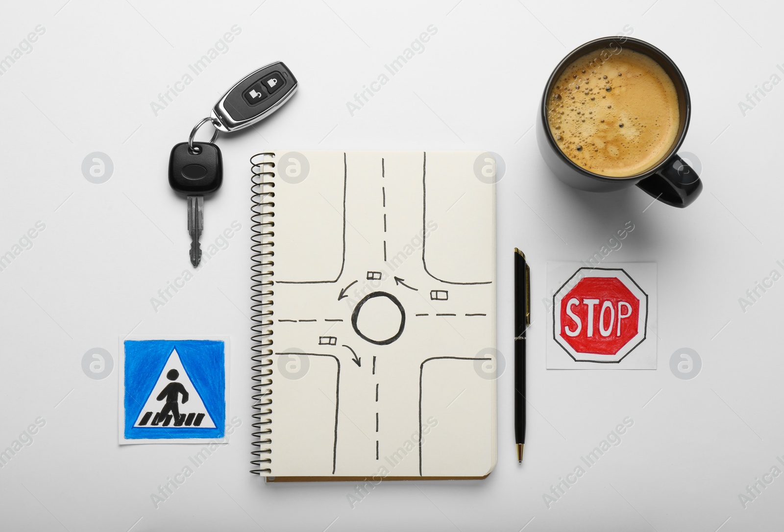 Photo of Composition with workbook for driving lessons on white background, top view. Passing license exam