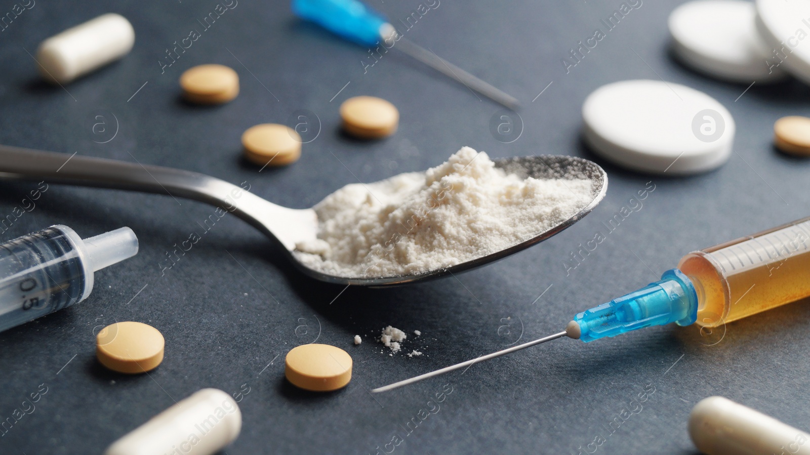 Photo of Different hard drugs on black background, closeup