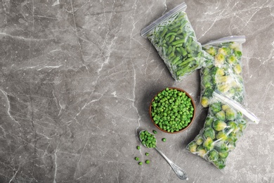 Photo of Different frozen vegetables on table, top view