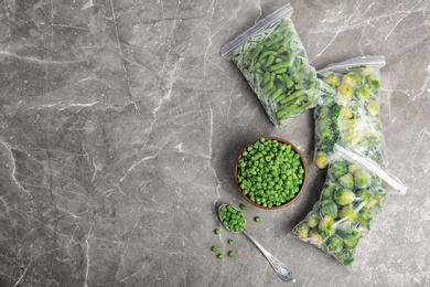 Different frozen vegetables on table, top view