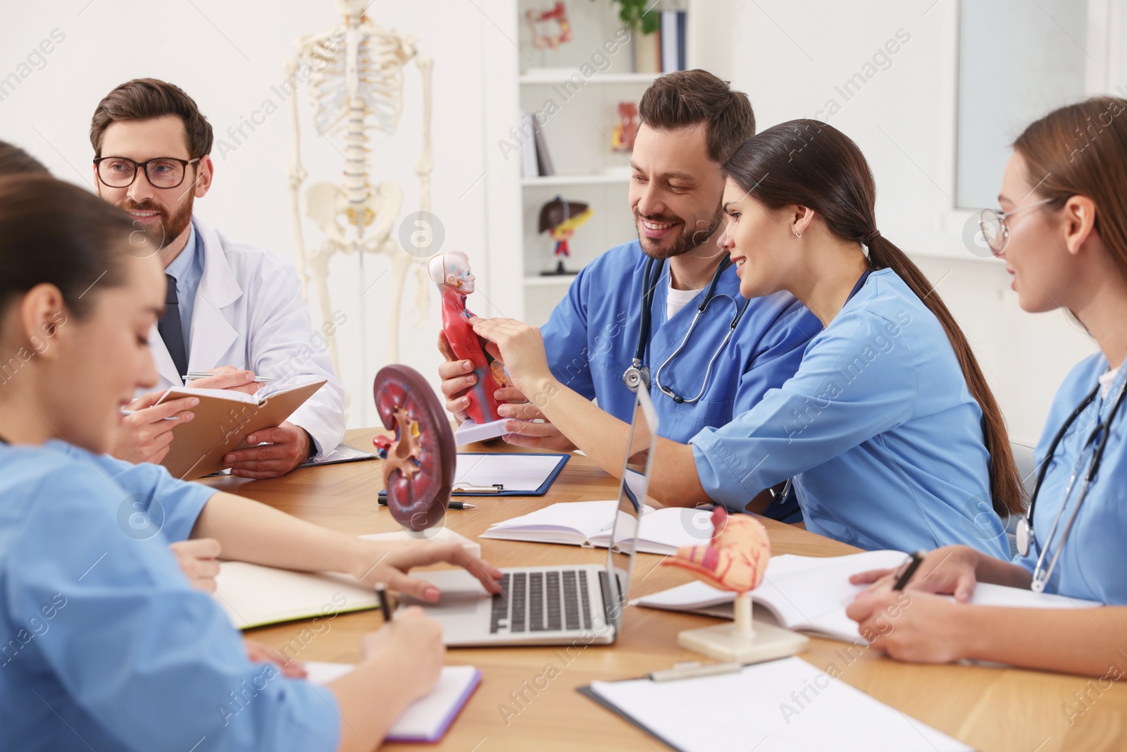 Photo of Medical students in uniforms studying at university