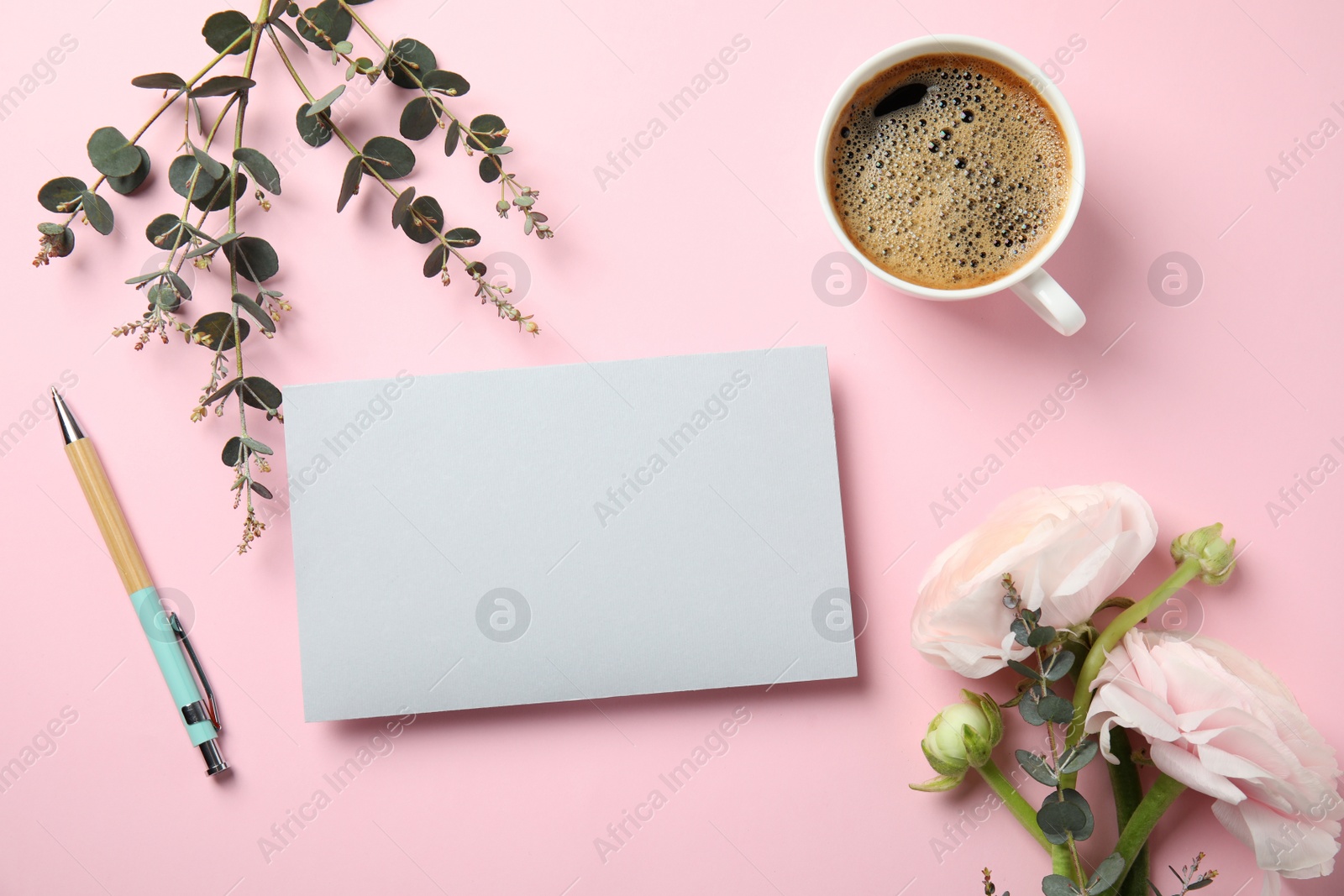 Photo of Flat lay composition with spring ranunculus flowers and card on color background. Space for text