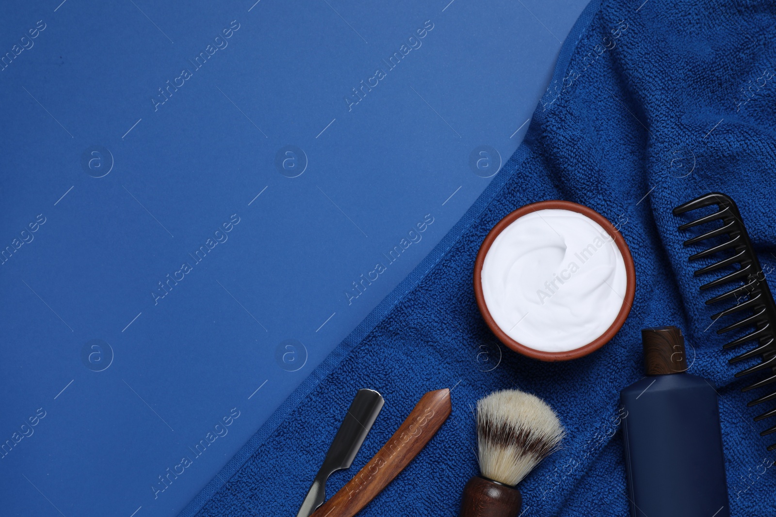 Photo of Composition with men's shaving accessories on blue background, flat lay. Space for text