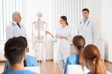 Medical students having lecture in orthopedics at clinic