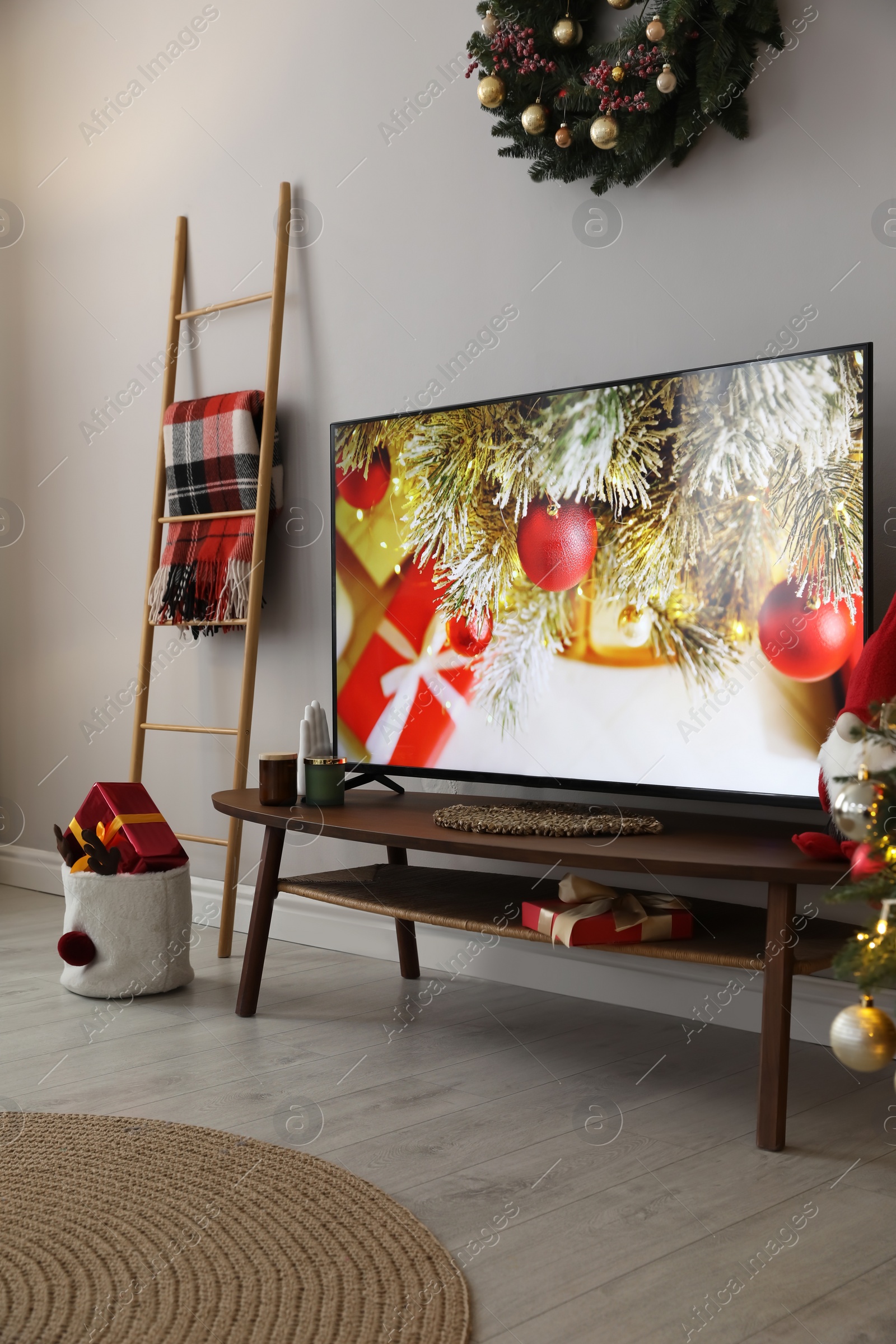 Photo of Modern TV and Christmas decor in room