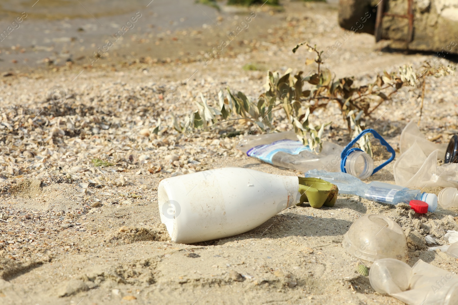 Photo of Garbage scattered on beach. Environment pollution problem