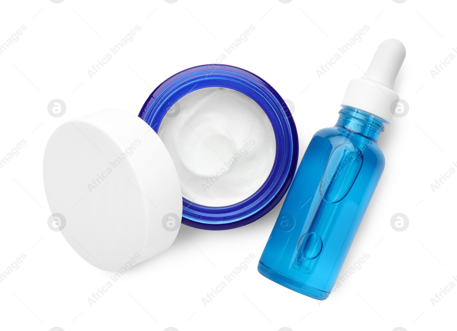 Photo of Jar and bottle of cosmetic products isolated on white, top view