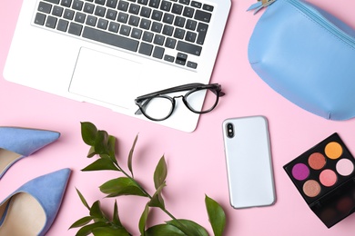 Photo of Flat lay composition with laptop and beauty blogger's stuff on pink background