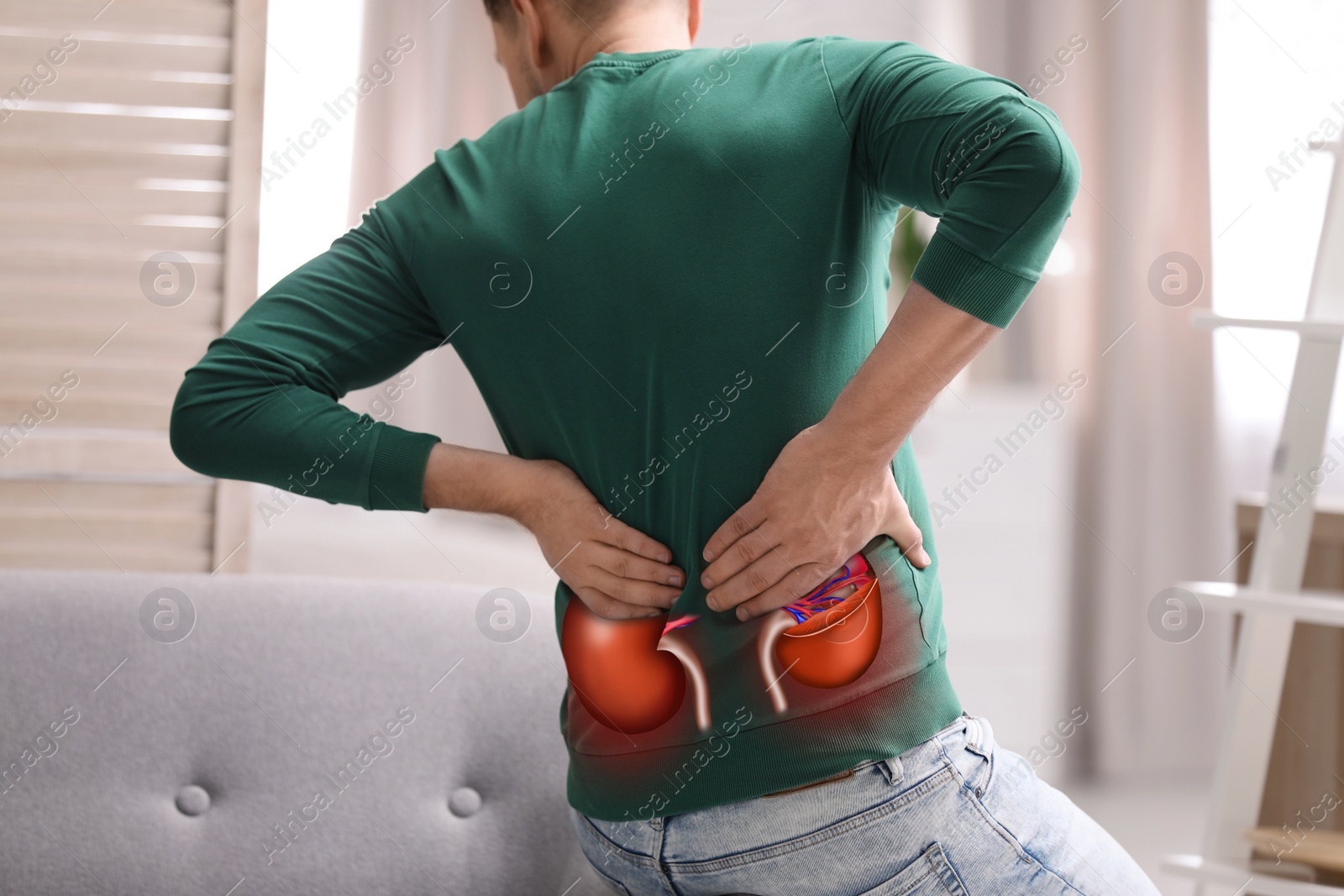 Image of Man suffering from kidney pain at home, closeup