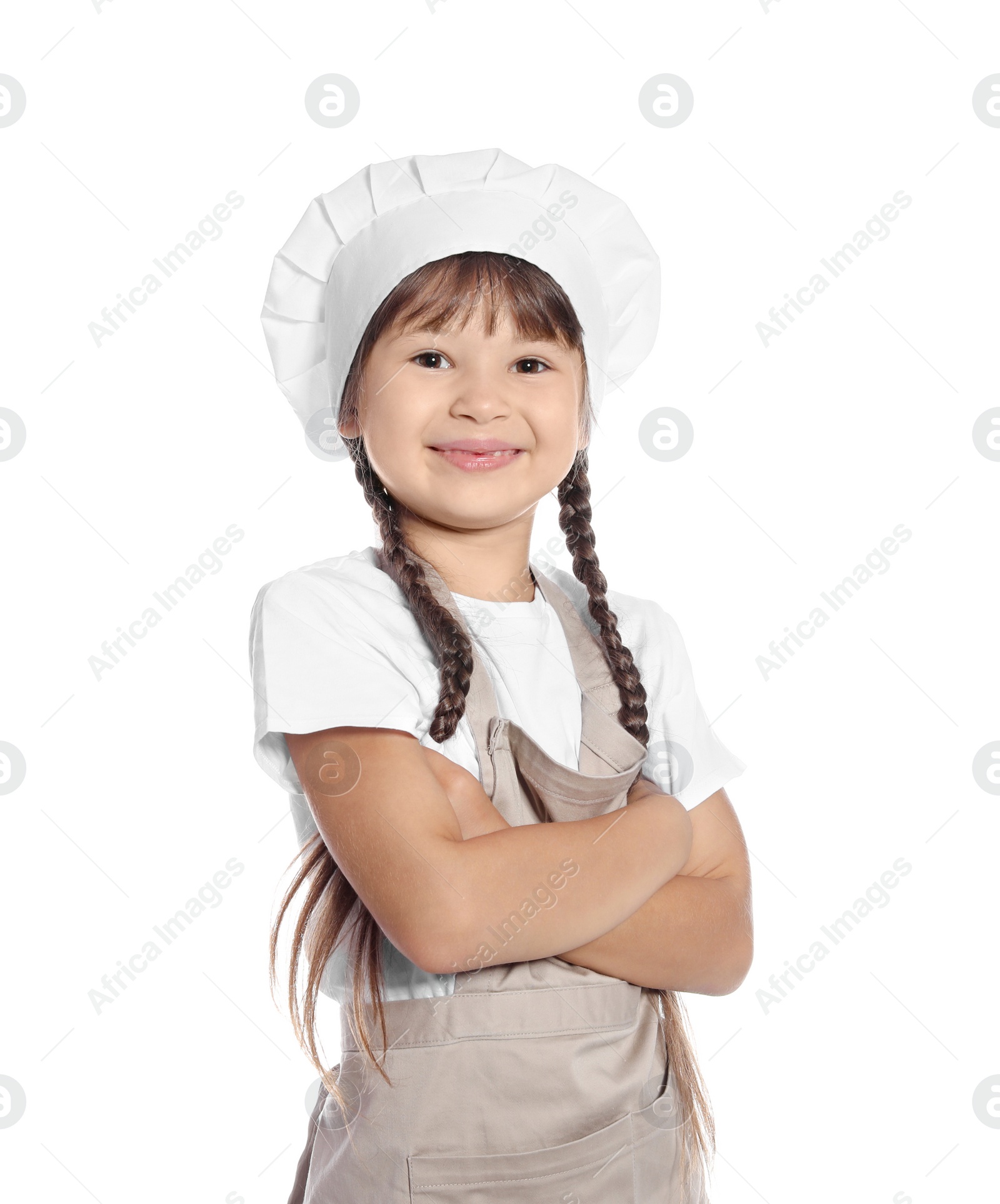 Photo of Portrait of little girl in chef hat on white background