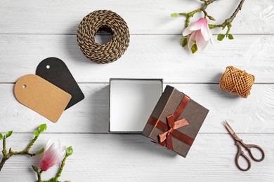 Photo of Beautiful composition with gift box on wooden background