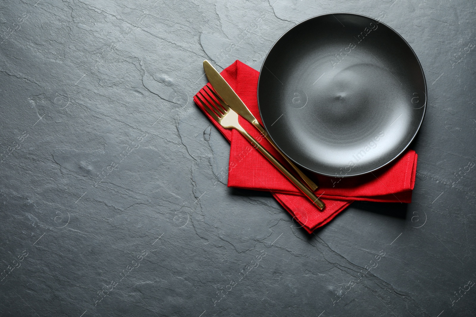 Photo of Beautiful table setting on black background, top view. Space for text