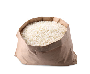 Photo of Uncooked rice in paper bag isolated on white