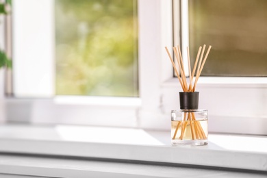 Photo of Aromatic reed air freshener on windowsill