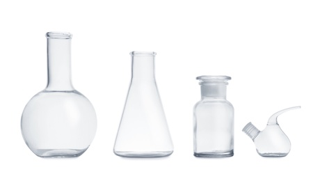 Photo of Set of empty laboratory glassware on white background